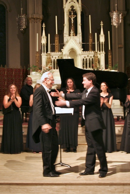 Vladimir Pleshakov and Dan Foster embrace during the standing ovation