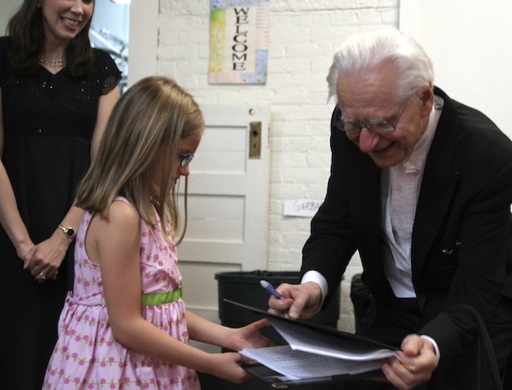 Micaela Sands gets Maestro Pleshakov’s autograph, Kristin Sands looks on